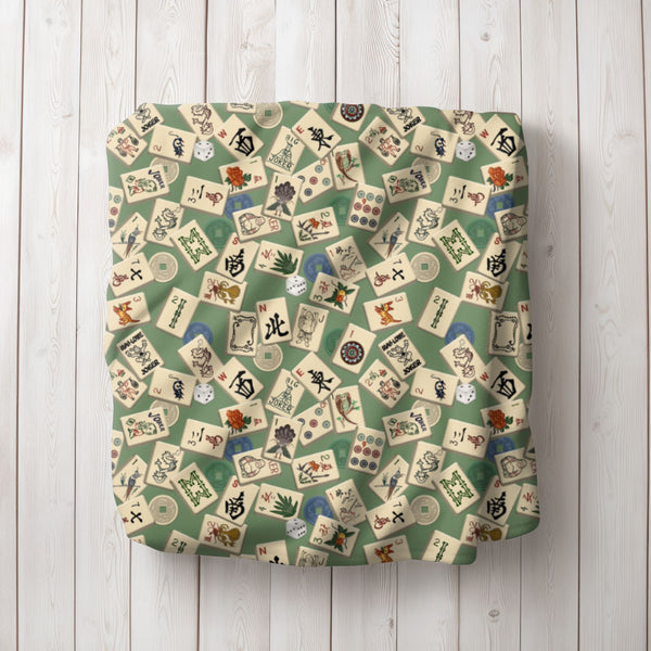 Scattered Mahjong Tiles Blanket on Green