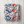 Classic American Mahjong Mania Blanket patterns draped over a white armchair.