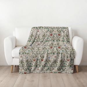 Flower Garden Blanket pattern laid out on a wooden floor.