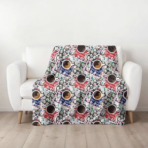 Mahjong and Coffee Blanket draped over a white armchair.