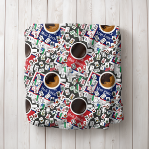 Mahjong and Coffee Blanket draped over a white armchair.